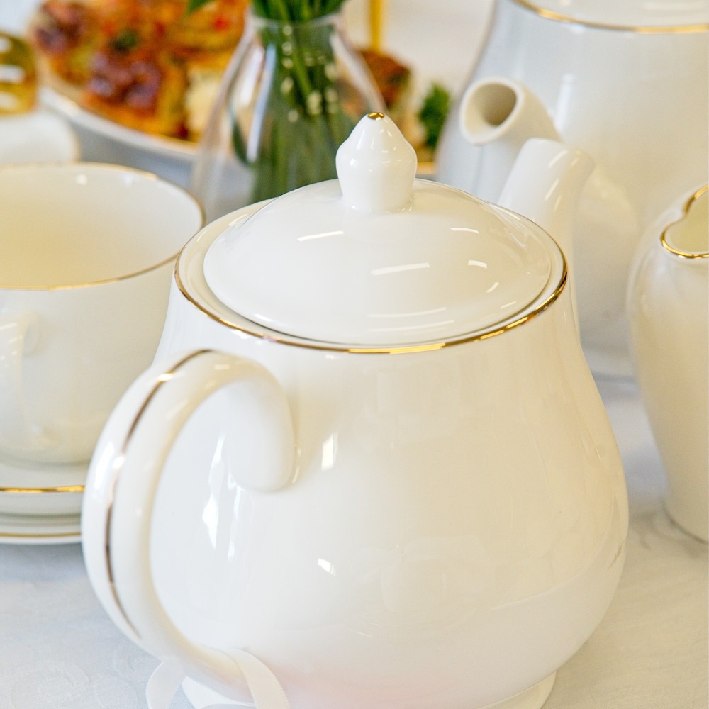 Cream gold-rimmed teapot